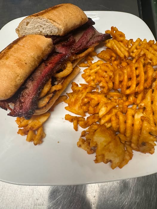 Smoked brisket sandwich with waffle fries